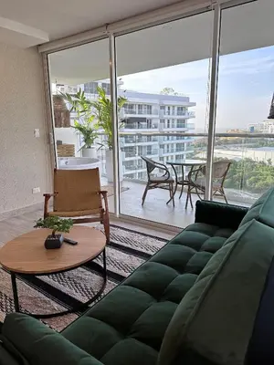 a living room with a couch and a table at DQ1301 | 2H Jacuzzi privado + piscina infinita in Cartagena de Indias