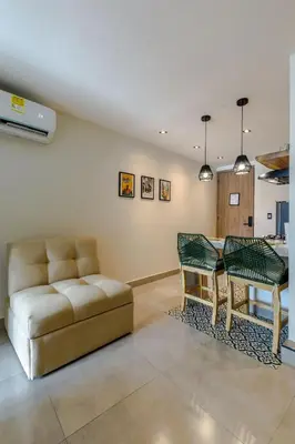 a living room with a couch and a table at De la cruz Studio Apartments in Cartagena de Indias