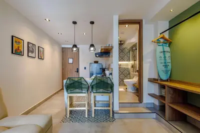 a living room with a table and two chairs at De la cruz Studio Apartments in Cartagena de Indias