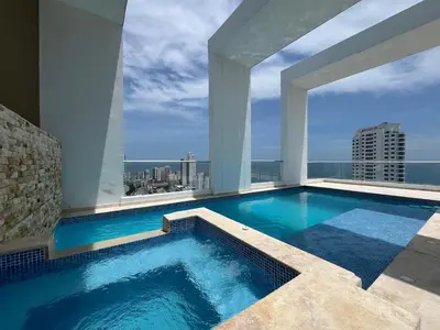 a swimming pool on the roof of a building at Bocagrande Loft - Livin Colombia in Cartagena de Indias