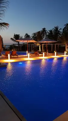 a swimming pool with blue lights in a resort at Apartamento Vista al Mar Morros Eco in Cartagena de Indias