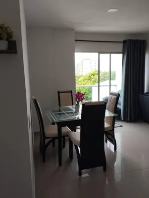 a dining room with a glass table and chairs at Apartamento en Cartagena, Zona Urbana in Cartagena de Indias