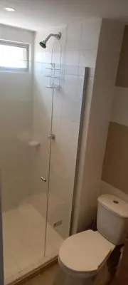 a bathroom with a toilet and a glass shower at Apartamento - Edf Acuarium - Torices in Cartagena de Indias
