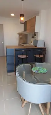 a kitchen with a table and some chairs in a room at Apartamento - Edf Acuarium - Torices in Cartagena de Indias