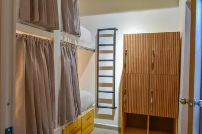 a bedroom with a ladder and a bunk bed at Casa Helena Hostel in Cartagena de Indias