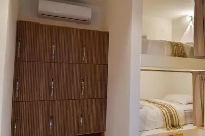 a bedroom with two bunk beds and a bed at Casa Helena Hostel in Cartagena de Indias