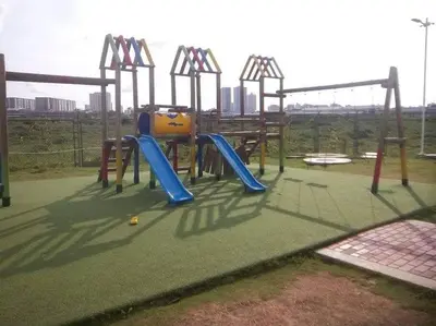 an empty playground with a slide and swings at Apartamento Cartagena - Terrazas de Calicanto in Cartagena de Indias