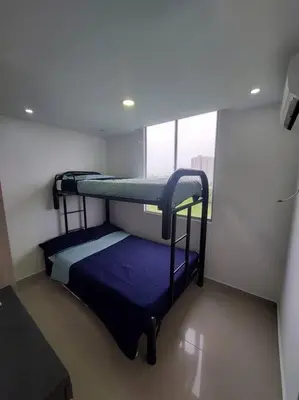 two bunk beds in a room with a window at Apartamento Cartagena - Terrazas de Calicanto in Cartagena de Indias