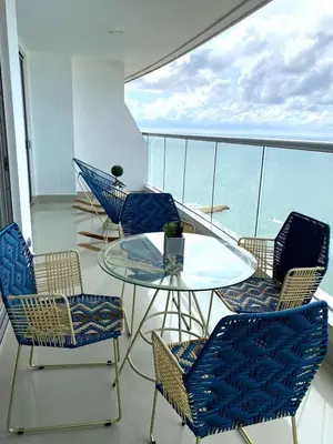 a balcony with a glass table and chairs at U-GO Palmetto Eliptic - Confort y Estilo en Cartagena in Cartagena de Indias