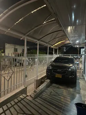 a car is parked under a car garage at Tropical Caribean Apartment in Cartagena de Indias