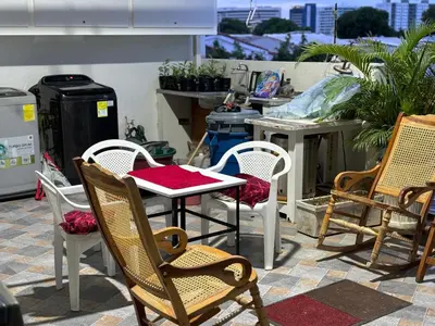 a patio with a table and chairs on a patio at Tropical Caribean Apartment in Cartagena de Indias