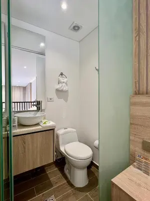a bathroom with a toilet and a sink and a mirror at Beautiful! Brand New Apt old town in Cartagena de Indias