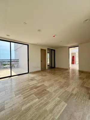 an empty room with a wooden floor and large windows at Beautiful! Brand New Apt old town in Cartagena de Indias