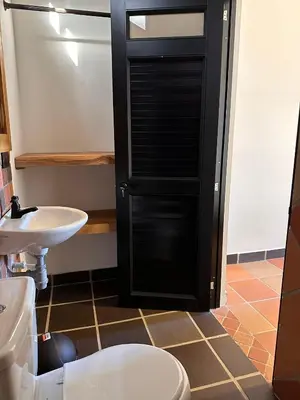 a bathroom with a toilet and a sink at Santa Donama Paradise in Santa Marta