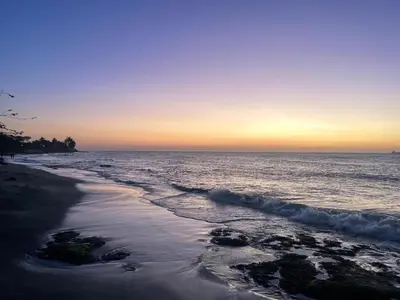 a view of the beach at sunset at Santa Donama Paradise in Santa Marta