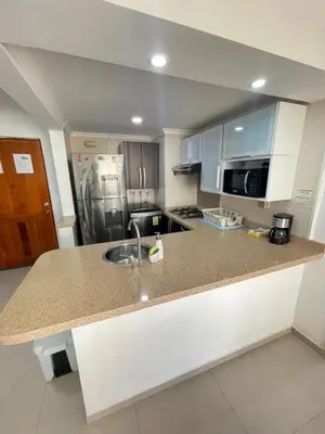 a kitchen with a sink and a stainless steel refrigerator at Cabrero Beach 906 in Cartagena de Indias