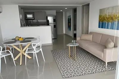 a living room with a couch and a table at Apartamento 2 Dormitorios Vista Mar. Piscina in Cartagena de Indias