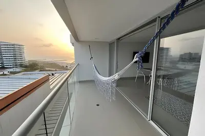 a hammock on the balcony of a house at Apartamento 2 Dormitorios Vista Mar. Piscina in Cartagena de Indias