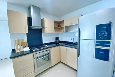 a kitchen with a refrigerator and a stove at 2 dormitorios Morros. Vistas y salida playa in Cartagena de Indias