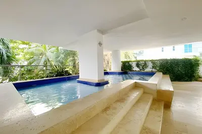 a swimming pool in the middle of a house at 2 dormitorios Morros. Vistas y salida playa in Cartagena de Indias