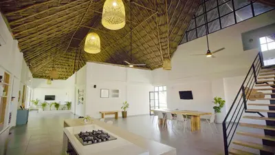 a large room with a table and chairs in it at Cosamui Beach House in San Bernardo del Viento
