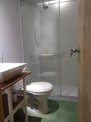 a bathroom with a shower and a toilet and a sink at Confortable apto en Coveñas in Coveñas
