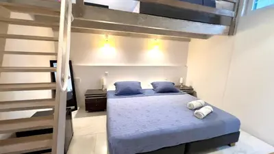 a bedroom with a bunk bed with blue sheets and blue pillows at Casa Lazuli 303 Cartagena in Cartagena de Indias