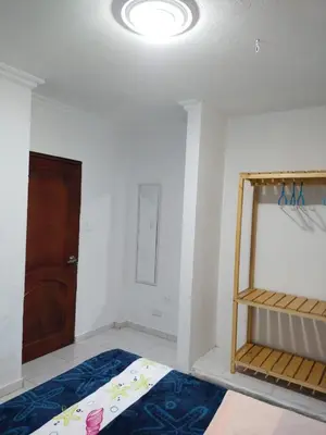 a room with a bunk bed and a door at Hostal Renacer in Cartagena de Indias