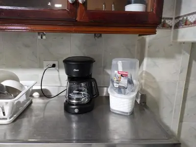 a coffee maker sitting on top of a kitchen counter at Hostal Renacer in Cartagena de Indias