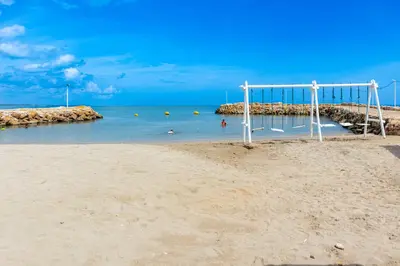 an empty beach with an empty goal in the sand at Ilukas & Resort Villas in Coveñas