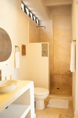 a bathroom with a sink and a toilet and a shower at Ilukas & Resort Villas in Coveñas