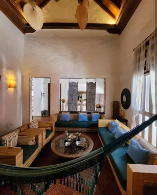 a living room with a couch and a table at CASA AMOR, Old Town 4 BDR in Cartagena de Indias