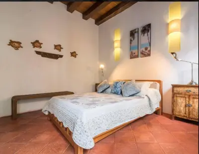 a bedroom with a bed in a room at CASA AMOR, Old Town 4 BDR in Cartagena de Indias