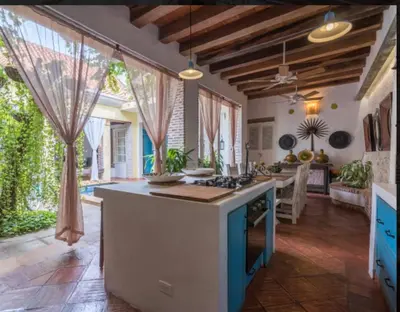 a kitchen with a large island in the middle of a room at CASA AMOR, Old Town 4 BDR in Cartagena de Indias