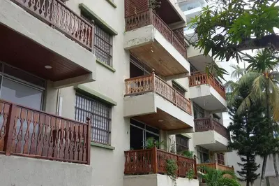a building with balconies on the side of it at Apartamento El Cabrero in Cartagena de Indias
