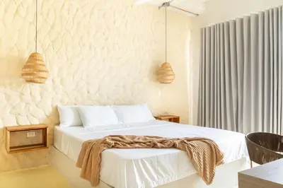 a bedroom with a bed with a blanket on it at Villa privada en coveñas sucre in Coveñas
