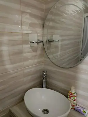a bathroom with a white sink and a mirror at Casa Topacio in Cartagena de Indias