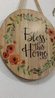 a sign that says bless this home with flowers on it at Cómodo apartamento para hospedaje in Cartagena de Indias