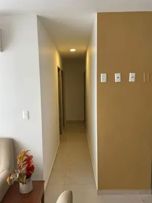 a hallway of a room with a long hallway sidx sidx sidx at Ambiente Caribe! piso 26 - 3 hab in Cartagena de Indias