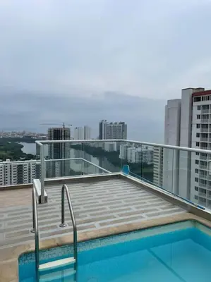a balcony with a swimming pool on top of a building at Ambiente Caribe! piso 26 - 3 hab in Cartagena de Indias