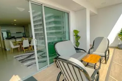 two chairs and a table on a balcony at Luxury View, 3 Rooms in Cartagena de Indias