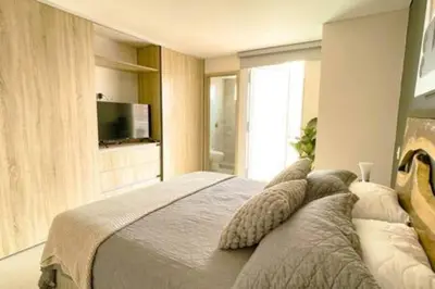 a bedroom with a large bed with pillows on it at Luxury View, 3 Rooms in Cartagena de Indias