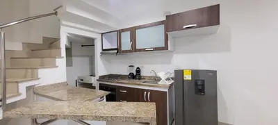 a small kitchen with a refrigerator and a counter at Excelente Apartamento Duplex in Sincelejo