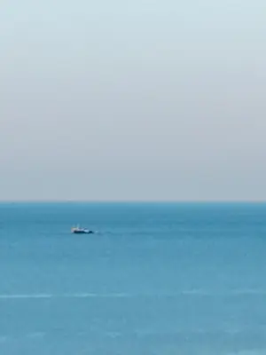a boat in the middle of a large body of water at Apartamento en Pozos Colorados Santa Marta Suite 1309 -Pozos Colorados in Santa Marta