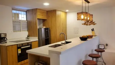 a kitchen with a sink and a refrigerator at Apartamento en Las Bovedas in Cartagena de Indias