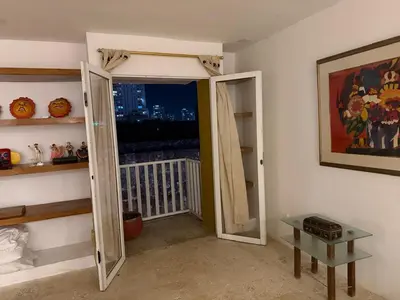 a room with a door open to a balcony at Apartamento en Las Bovedas in Cartagena de Indias