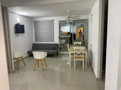a living room with a couch and a table and chairs at Apartamento Amoblado en Cartagena in Cartagena de Indias