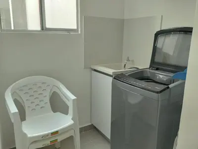 a bathroom with a sink and a washing machine at Apartamento Amoblado en Cartagena in Cartagena de Indias