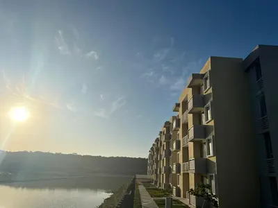 a building next to a body of water next to a building at Apartamento Amoblado en Cartagena in Cartagena de Indias
