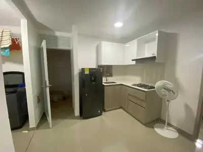 a kitchen with a refrigerator and a fan in it at Apartamento Amoblado en Cartagena in Cartagena de Indias